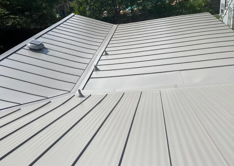 Solar attic fan installed on a metal roof for Roof Ventilation in Frankfort